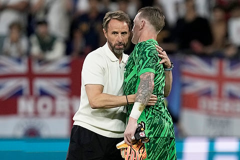 England's manager Gareth Southgate embraces Jordan Pickford
